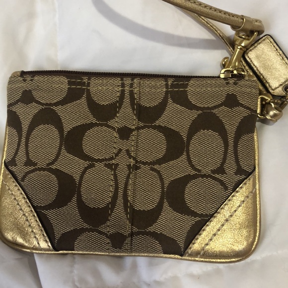 Tan and gold Coach wristlet with purple lining - Picture 2 of 4